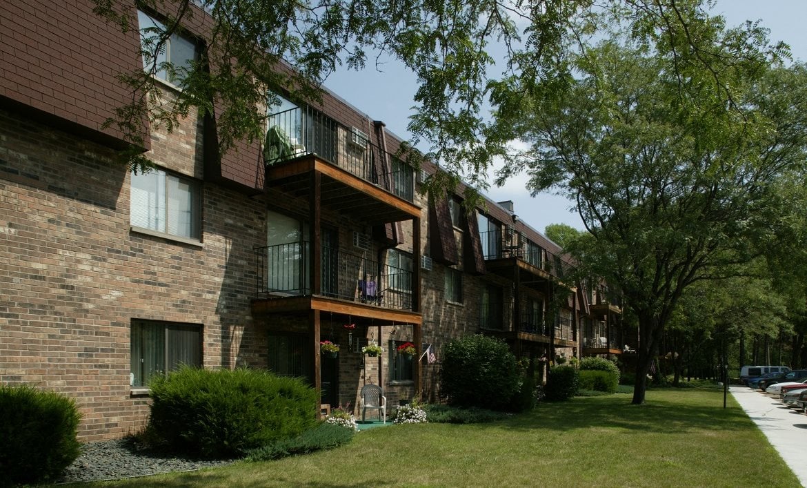 the village apartments forest lake exterior side view